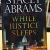 While Justice Sleeps: A Thriller - Stacy Abrams