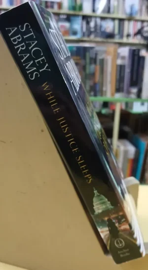 While Justice Sleeps: A Thriller - Stacy Abrams
